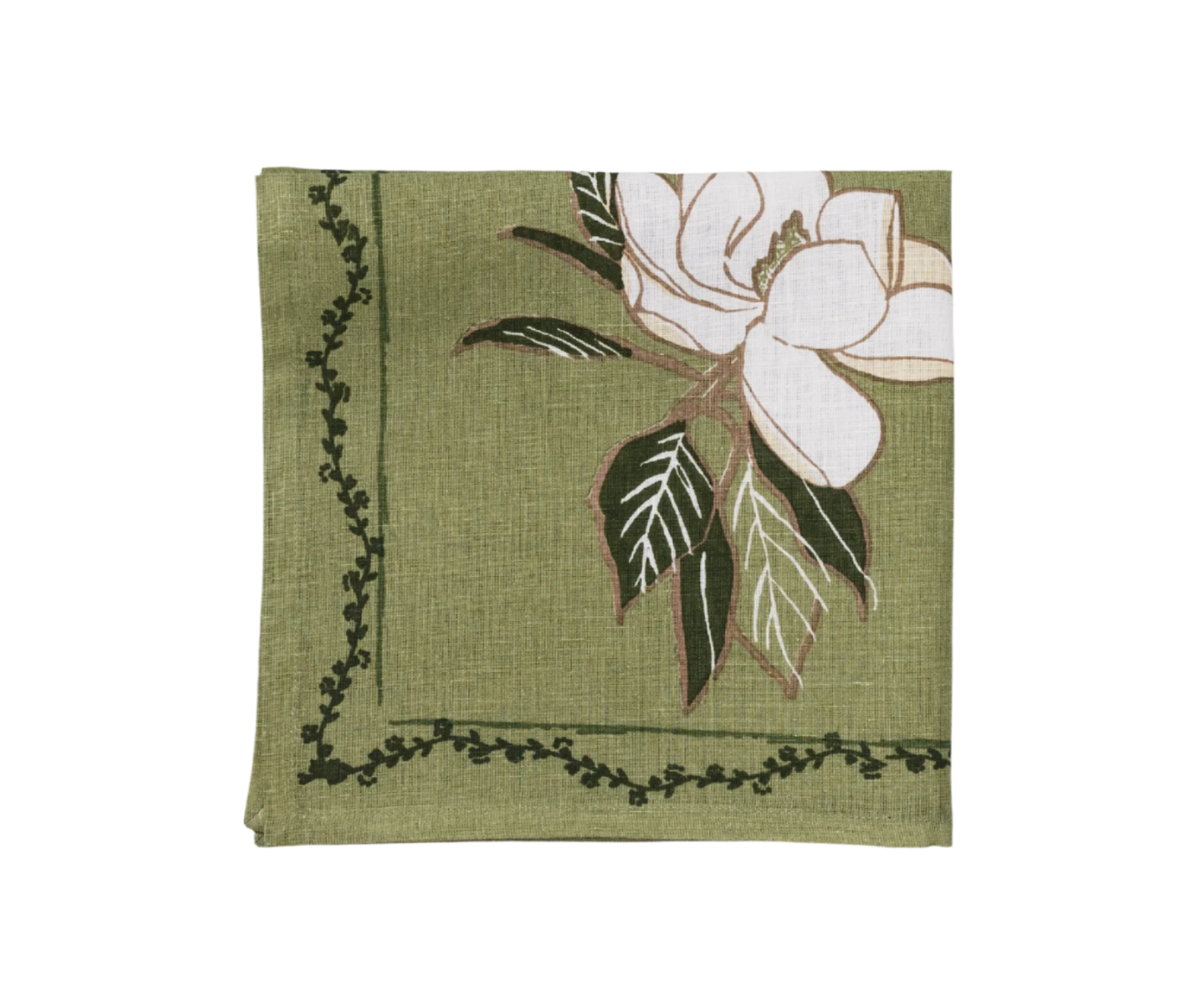 close up of magnolia flower on a green napkin