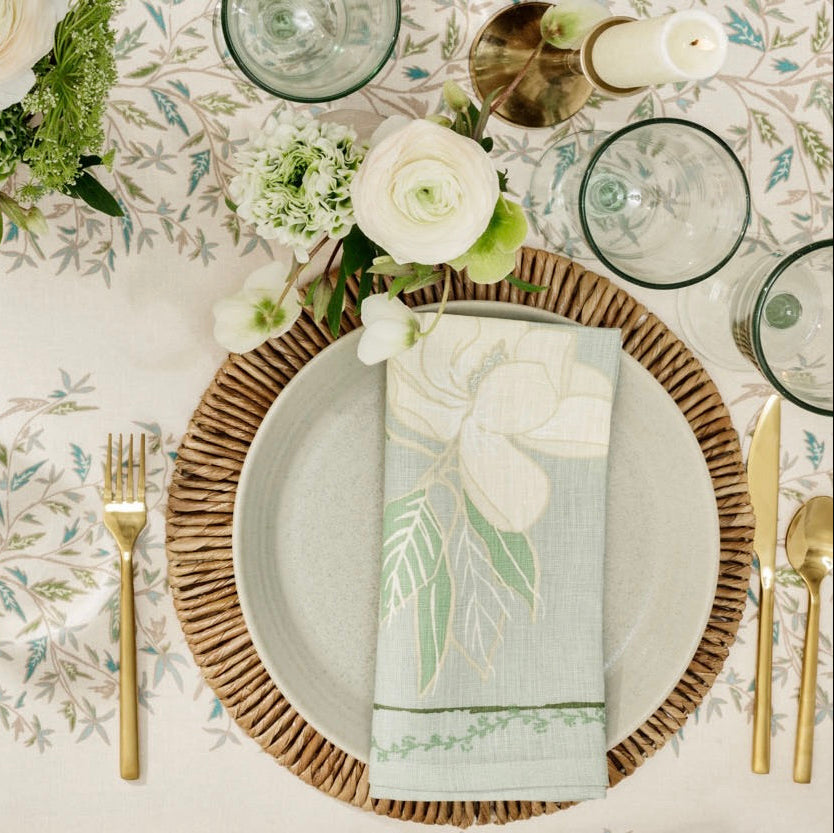 overhead shot of table with place setting and magnolia napkin