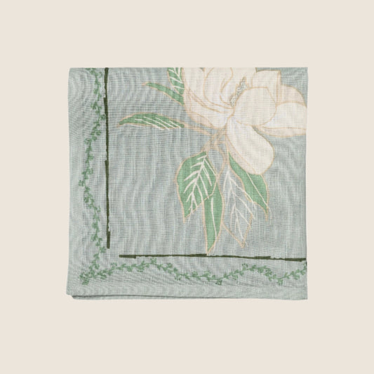 magnolia herb napkin on a white marble background