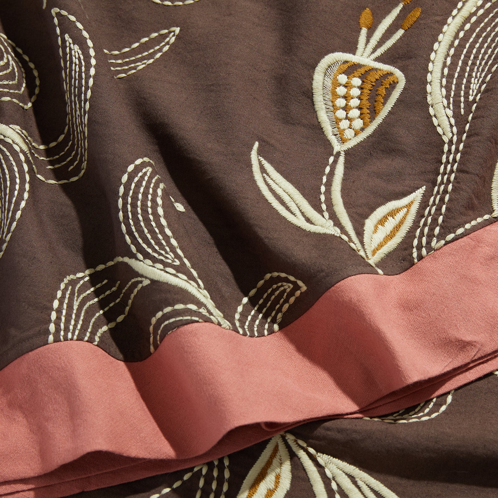 close up of marseille aubergine tablecloth