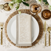 place setting on a white primrose tablecloth