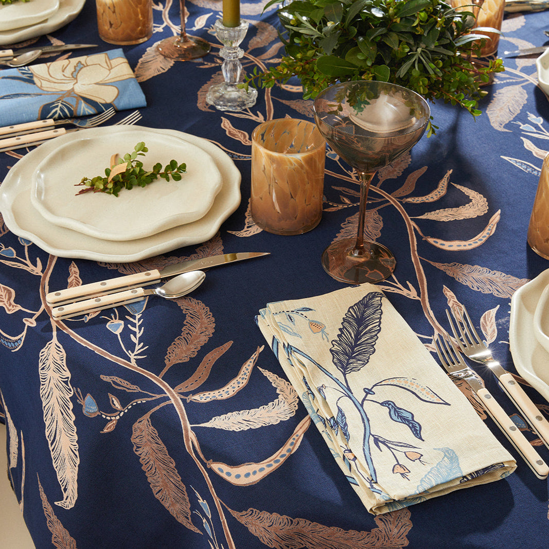 woody tablecloth tablescape with place settings and glasses